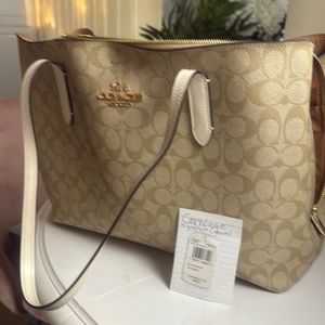 Coach Tan Tote with Monogram Design and Gold Accents